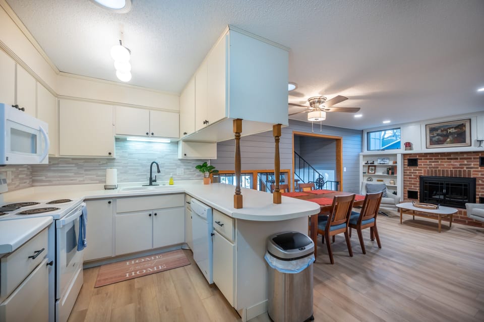 Full kitchen with a table that seats 6.