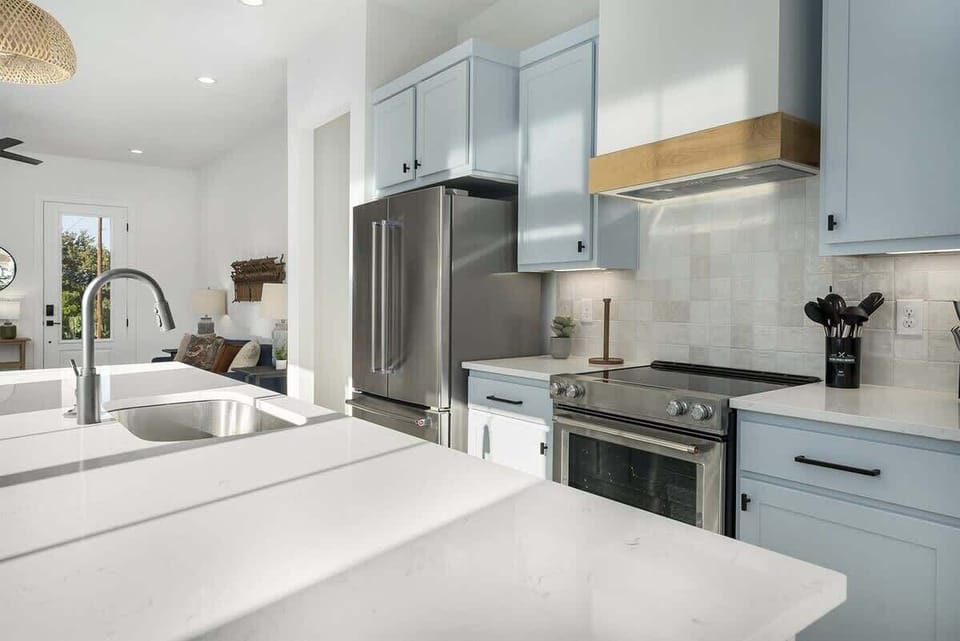 Modern and stylish kitchen with stainless steel appliances and marble countertops