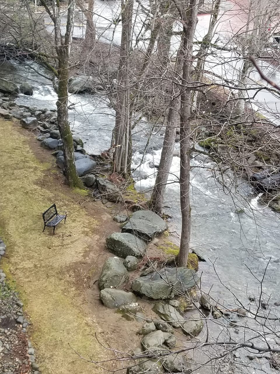 View down to river from balcony.  Can access through a gate in the parking lot