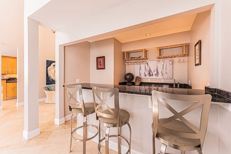 Wet Bar In Living Room with three bar height stools.