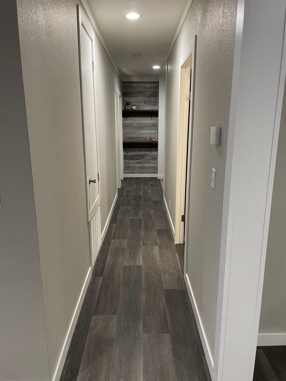 Hallway that leads to bedrooms, family room and 2nd bathroom.