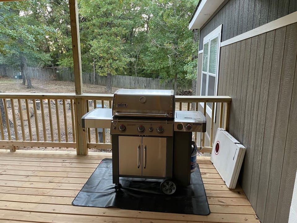 Propane grill and cornhole game set. 