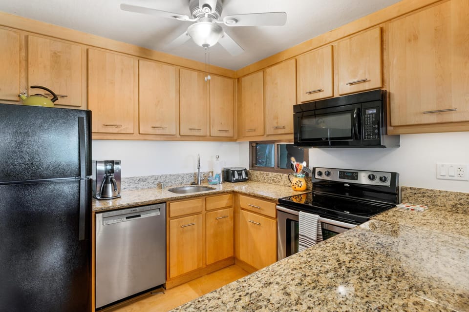 Fully kitchen with all the needed Appliances. Well-equipped kitchen with modern updates, full-size appliances, and everything needed for effortless meal prep during your stay.
