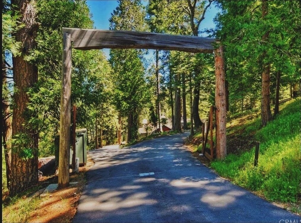 Entry gate to Little Bear Lodge located at the top of the access road.