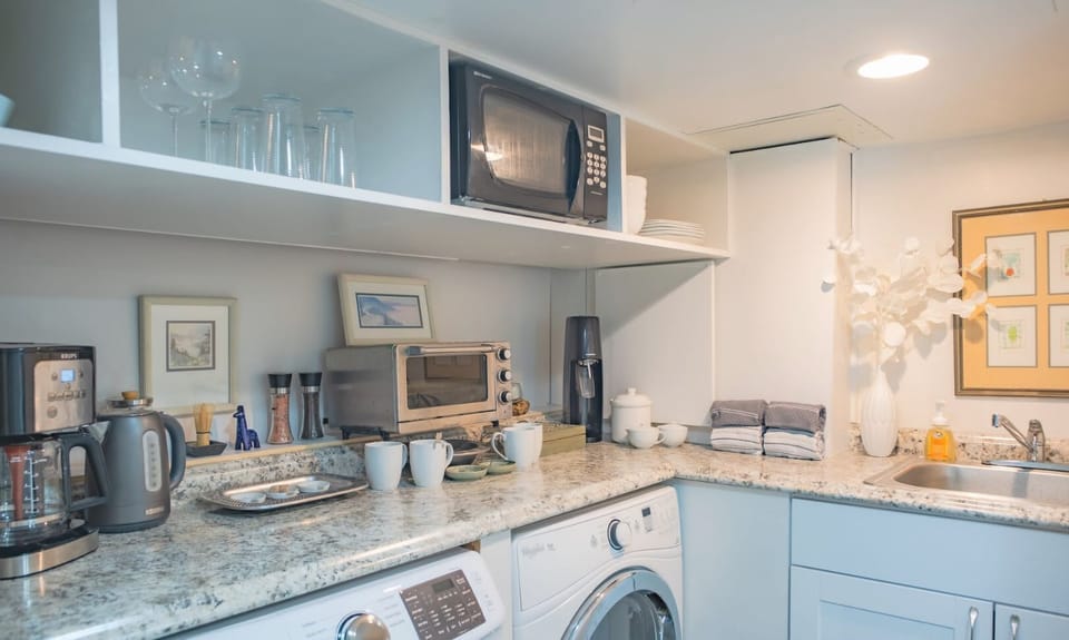 Modern kitchenette with open shelving.