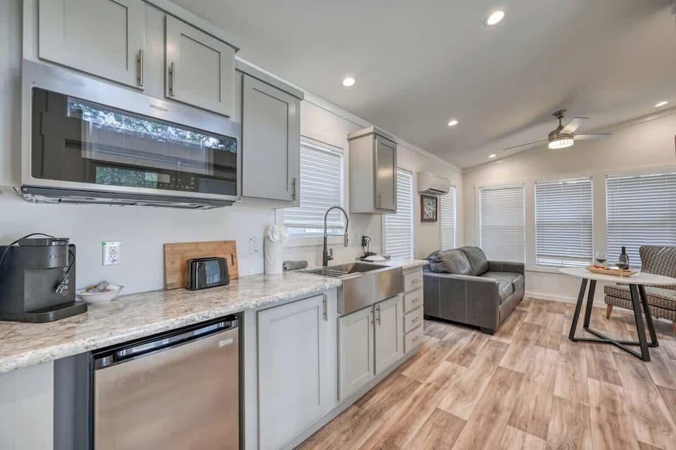 Convenient Kitchenette with a mini fridge, microwave, coffee pot and sink