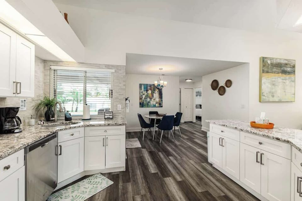 Our second dining area is conveniently located off the kitchen, adjacent to the pool area and guest rooms. It features easy-to-clean floors and a sleek granite countertop, making it both practical and stylish.