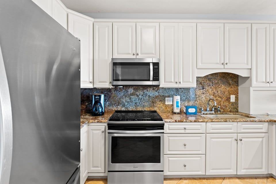 Your fully equipped kitchen features granite countertops, stainless steel appliances, and everything you need to prepare delicious meals during your stay.
