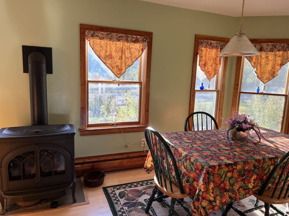 Kitchen dining area with gas stove.