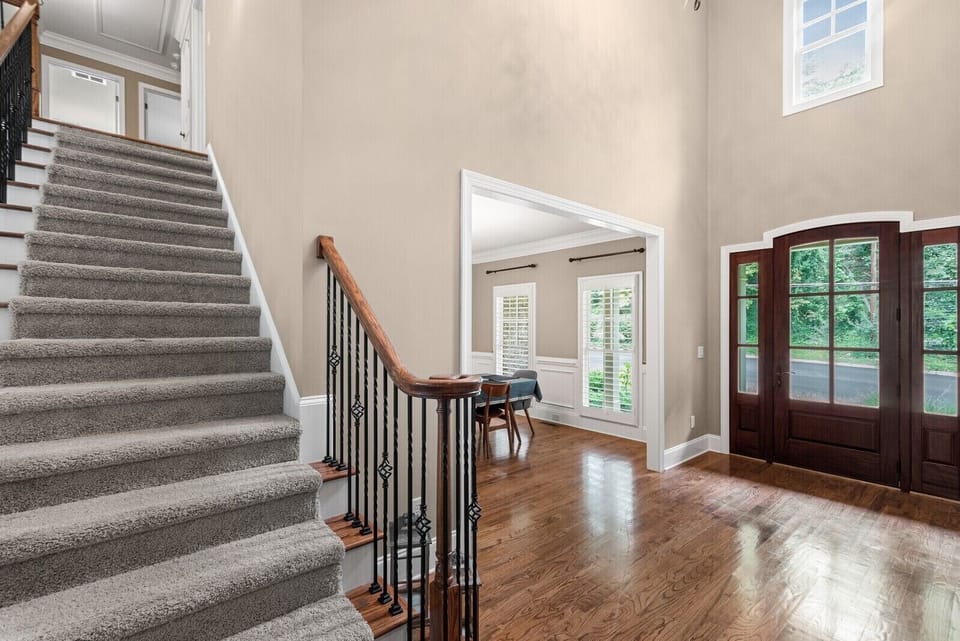 Stairs lead to 3 queen bedrooms and and 2 full bathrooms upstairs.