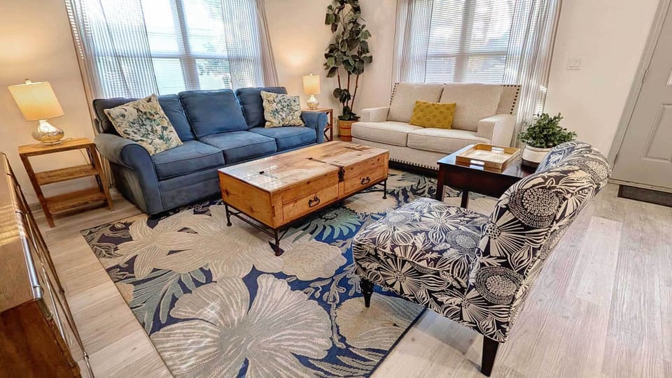 Cozy up after a day exploring in our living room which features comfortable seating, 65" Roku tv and a pull out queen sleeper sofa.