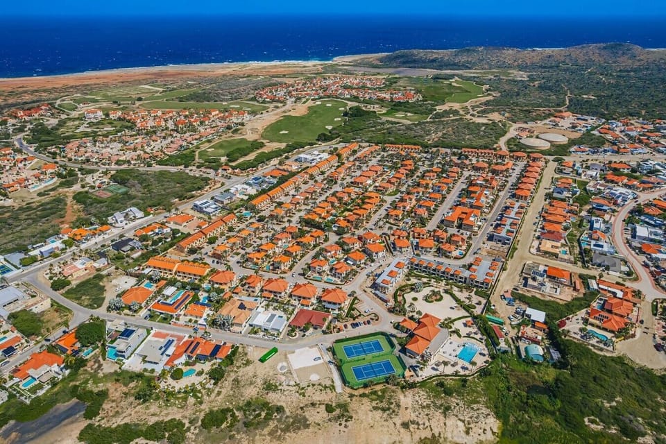Gold Coast Aruba is a luxurious, gated resort-style community located in the prestigious Malmok area on the northern coast of Aruba offering a mix of condominiums and villas, designed for guests seeking privacy, security, and upscale Caribbean living
