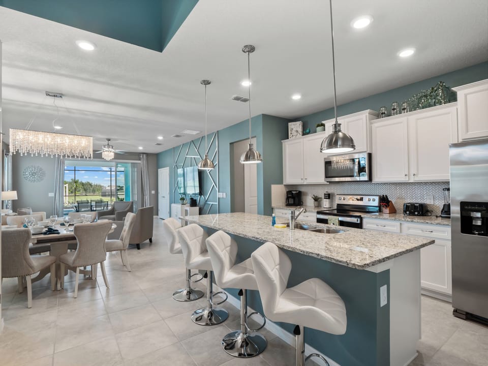 Spacious Downstairs Living Area with Full Size Kitchen and Barstool Seating
