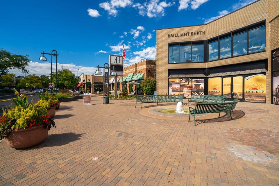 Charming downtown shopping district with brick plaza, fountain, and local boutiques just steps from your stay.