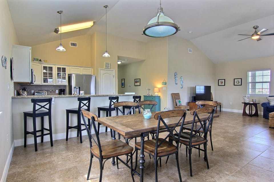 Stay Connected - Enjoy a family meal or a snack while chatting with the cook! The kitchen table is conveniently located next to all of the action.