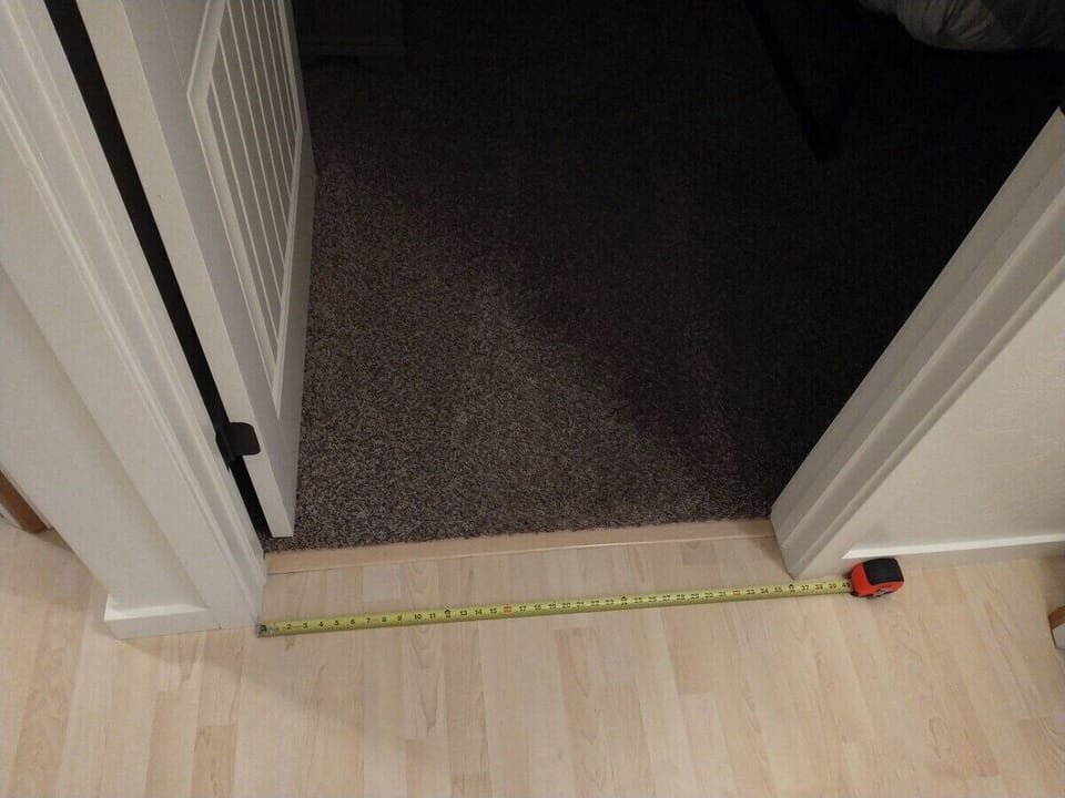 Entrance to guest bedroom is step-free and wider than 32 inches