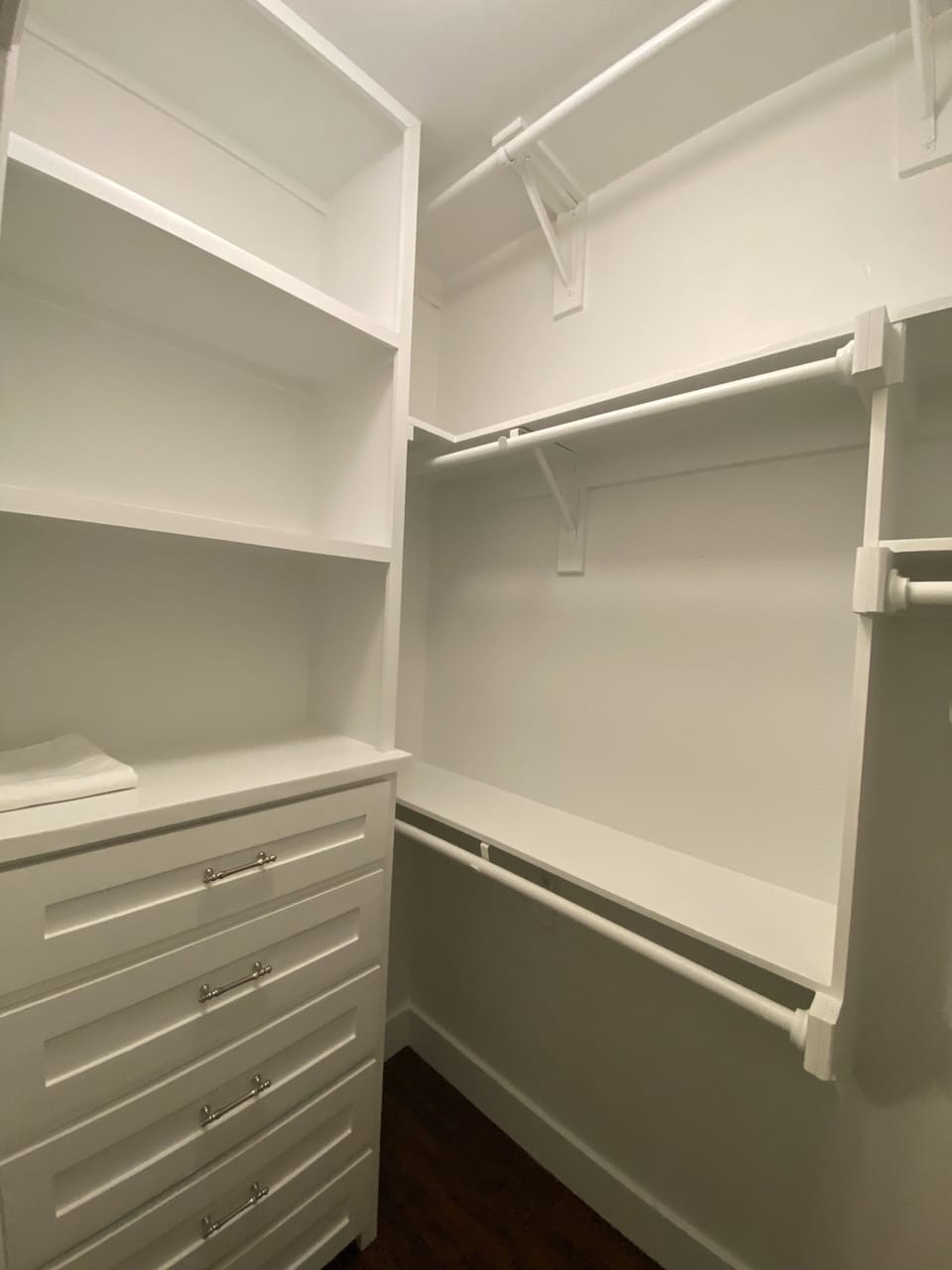 This walk-in closet with built-in dresser drawers sure to store all you have. 