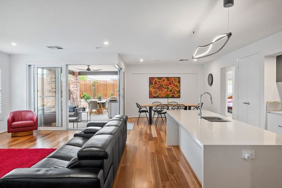 Main open plan living area opening up to an alfresco area