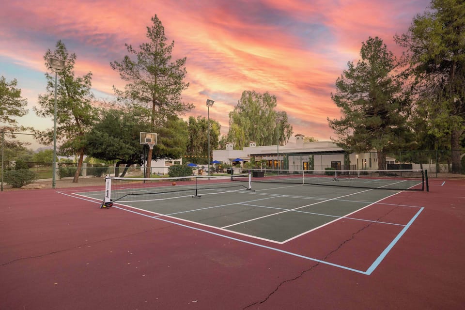 Gather for spirited matches beneath a fiery sky.