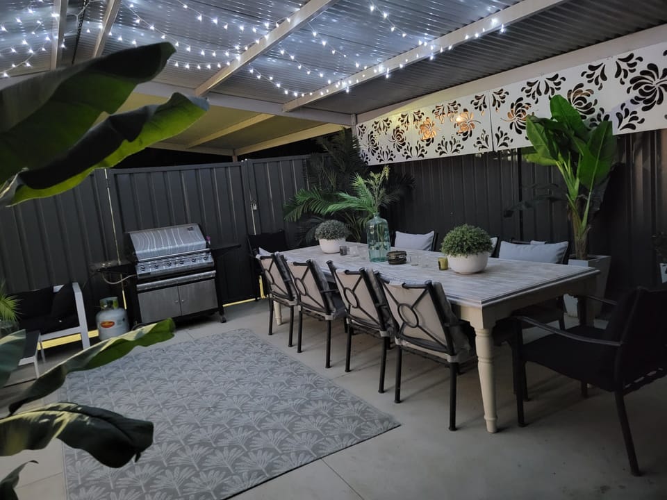 Outdoor entertaining with 10 seater table, bbq and outdoor lounges