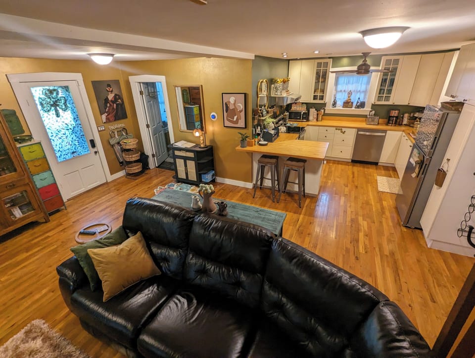 View of Kitchen and Primary Bathroom / Laundry entry on left