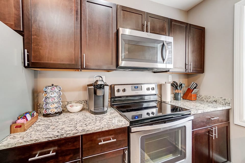 Fully stocked coffee and tea bar. Includes K cups, sugars, creamers, etc.
