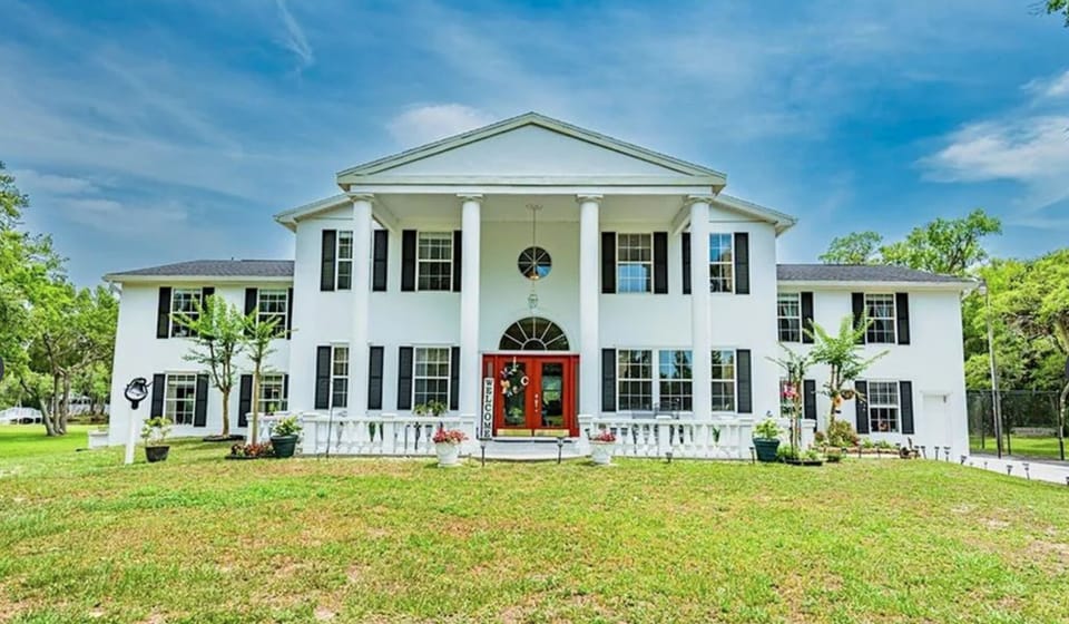 over 10 acres, 6 bedrooms, 5 full baths, game room, pool and tennis