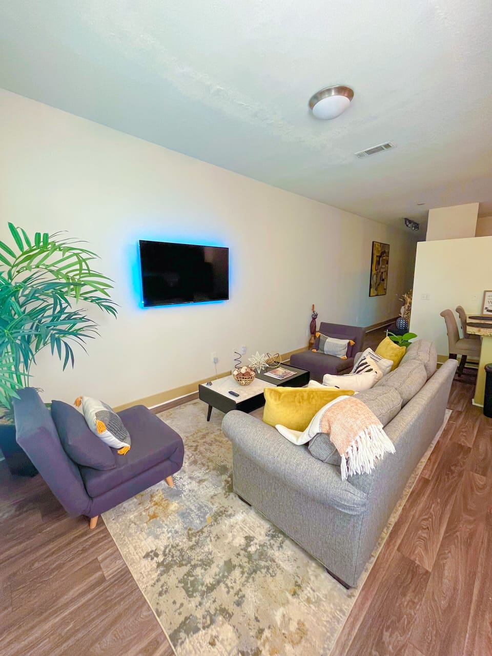 Couch pulls out to Queen foam mattress, each grey chairs unfolds into twin bed.