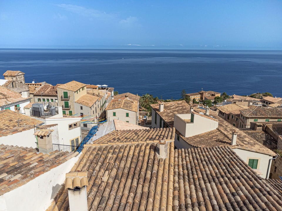 Sky, Water, Building, Azure, Wood, Urban Design, House, Horizon, Roof, Landscape