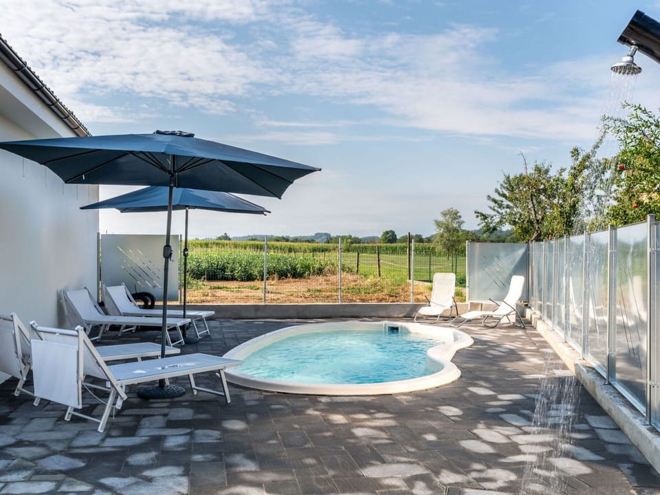 Water, Sky, Cloud, Azure, Swimming Pool, Shade, Outdoor Furniture, Leisure, Plant, Sunlounger