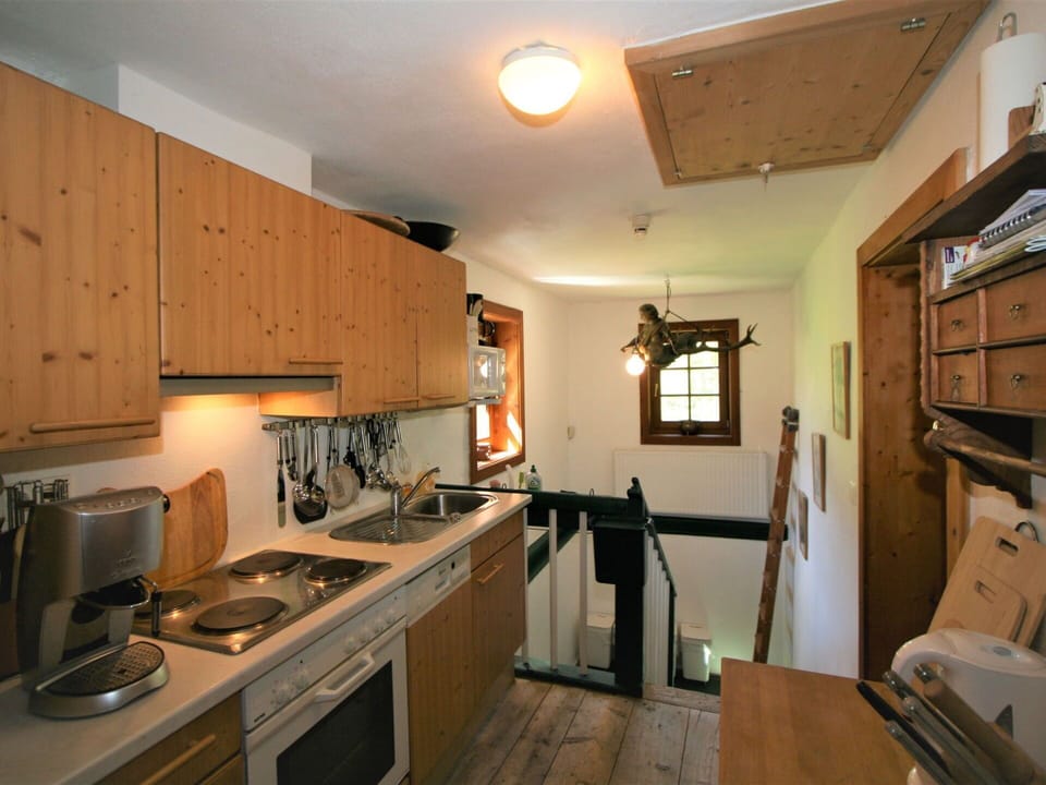 Cabinetry, Property, Furniture, Countertop, Kitchen Appliance, Gas Stove, Kitchen, Kitchen Stove, Wood, Home Appliance