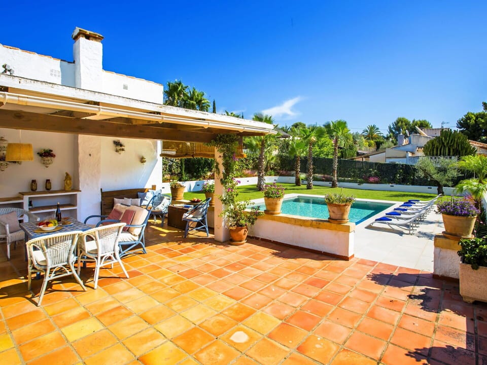 Sky, Plant, Furniture, Property, Flowerpot, Building, Chair, Azure, Swimming Pool, Outdoor Furniture