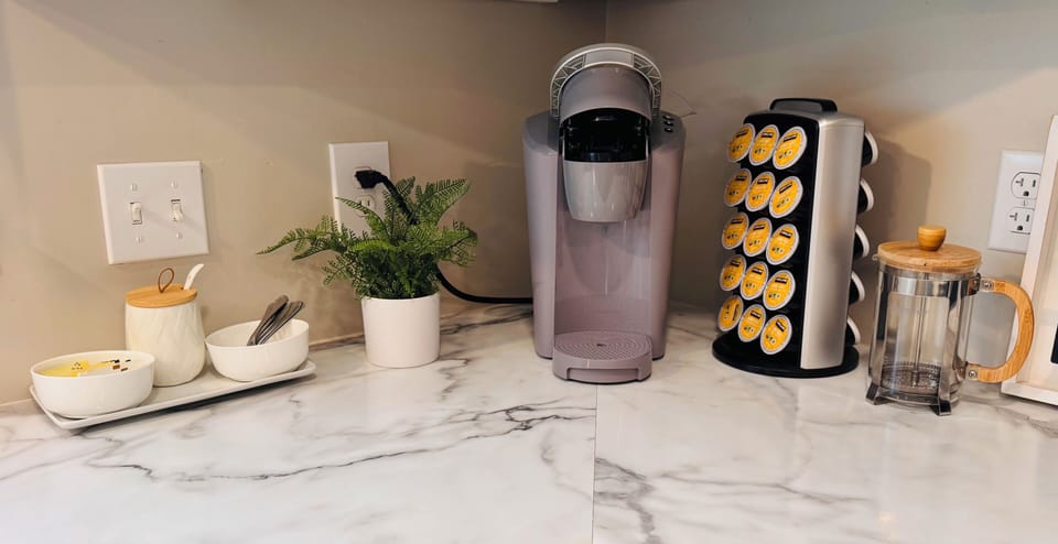 3 options- Keurig, French Press, and full size pot in cabinet w/coffee for all 3