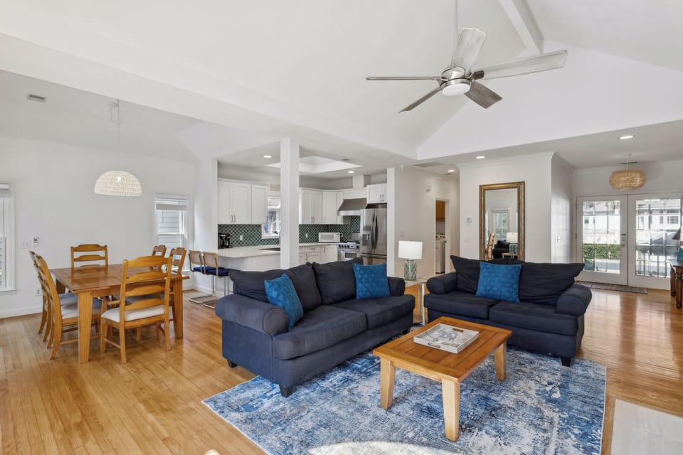 Living room featuring a flatscreen tv and a queen sleeper sofa.