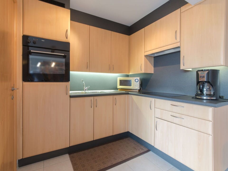 Cabinetry, Countertop, Property, Kitchen Appliance, Home Appliance, Kitchen Stove, Kitchen, Interior Design, Wood, Flooring