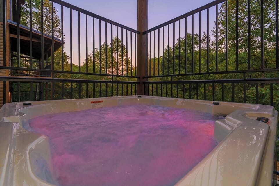 Hot Tub Retreat: Soak in the sunset views and vibrant colors while unwinding in style!