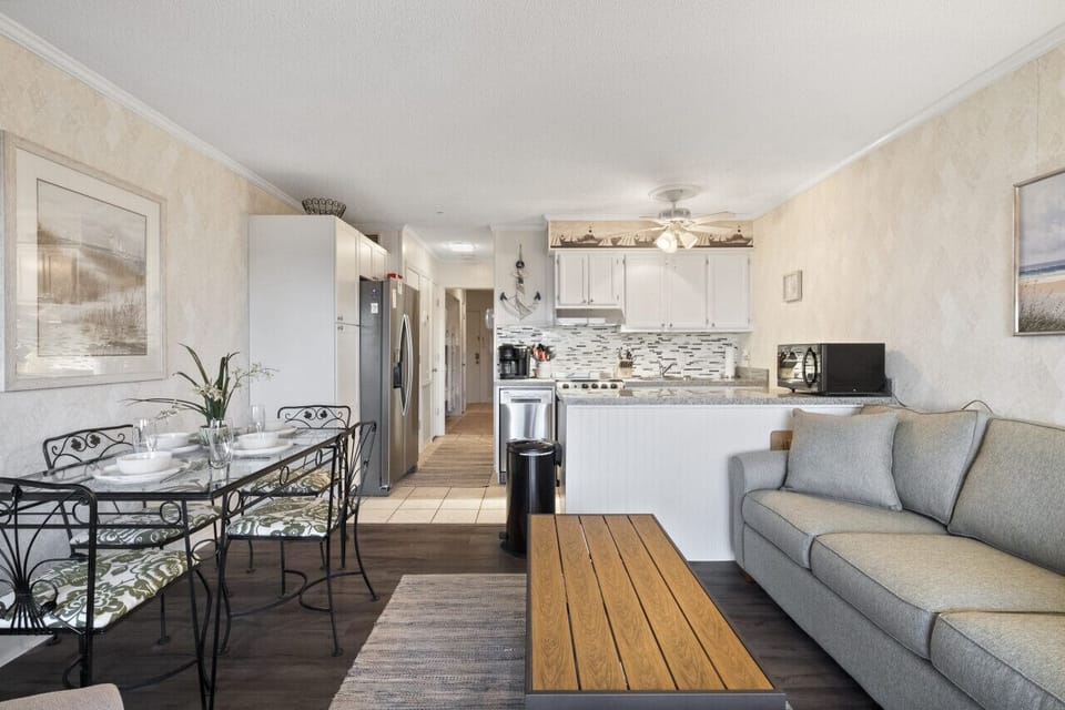View of entrance, hallway with bunks, kitchen, dining and living areas