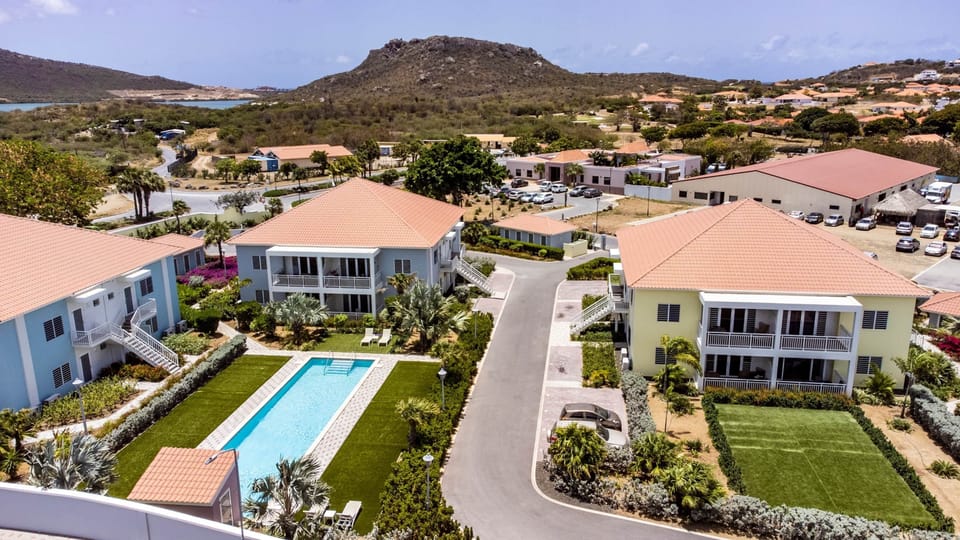 Drone view of the Blije Rust 2 resort and Blue Bay in the background.