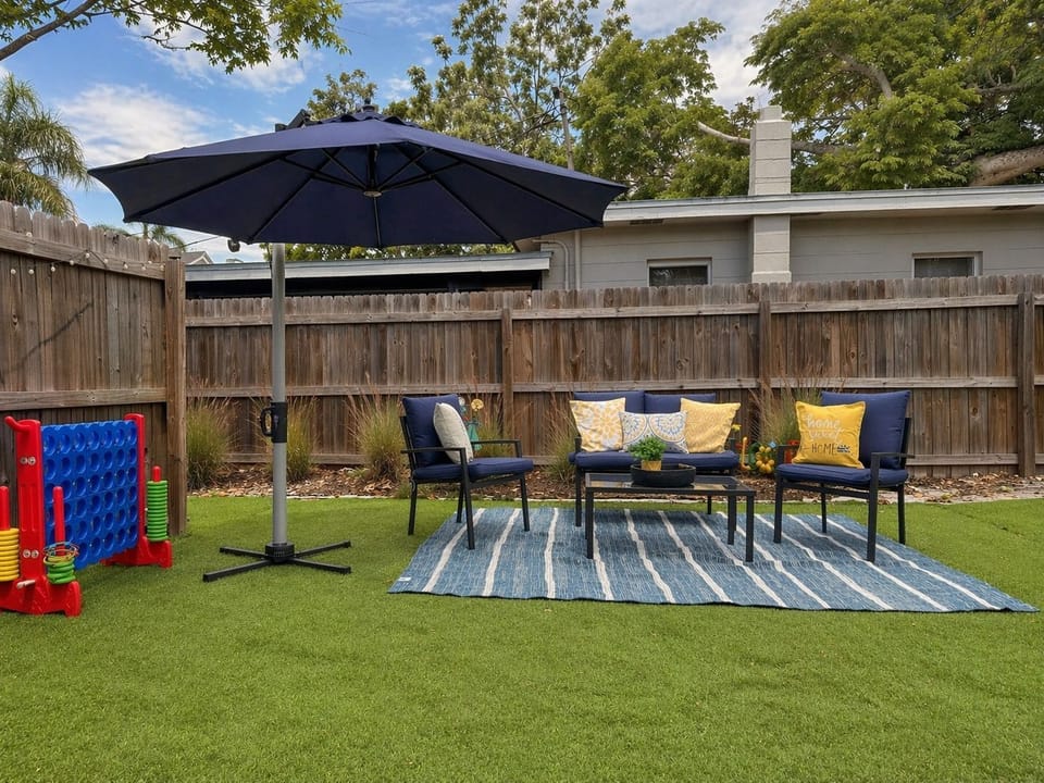 Spacious backyard with shaded lounge seating—perfect for relaxing or family time