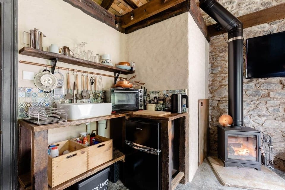 The Kitchen area, includes a microwave, and mini oven/air fryer. also includes a mini Fridge freezer