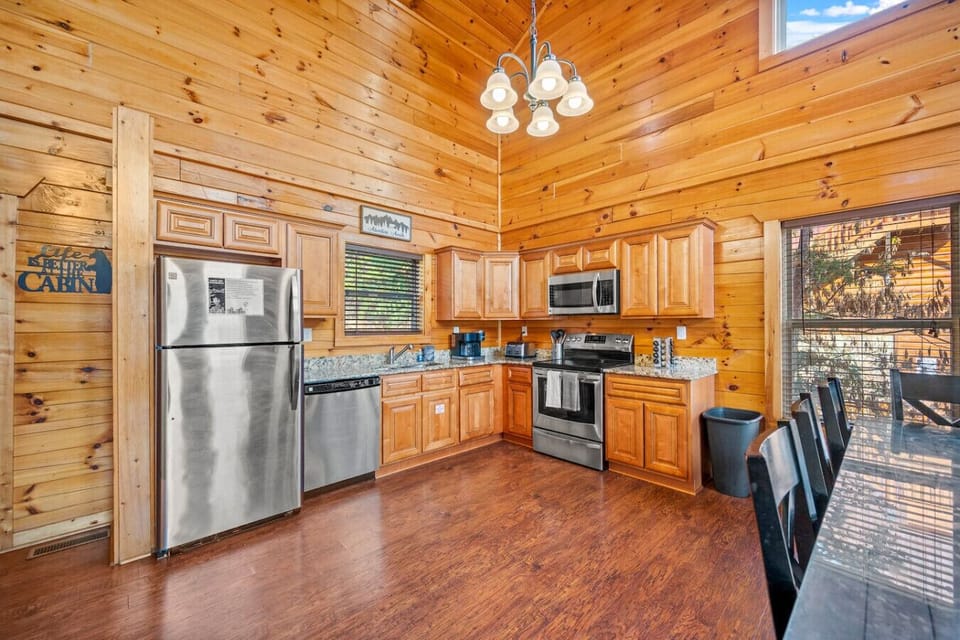 Full-sized kitchen with suite of stainless steel appliances.
