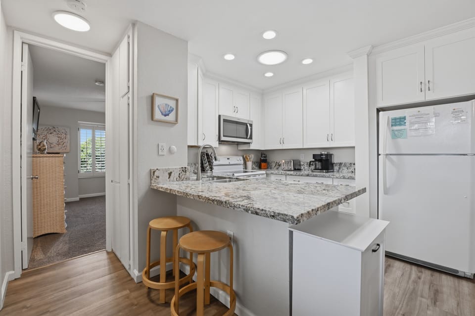 Fully remodeled kitchen and new flooring throughout.