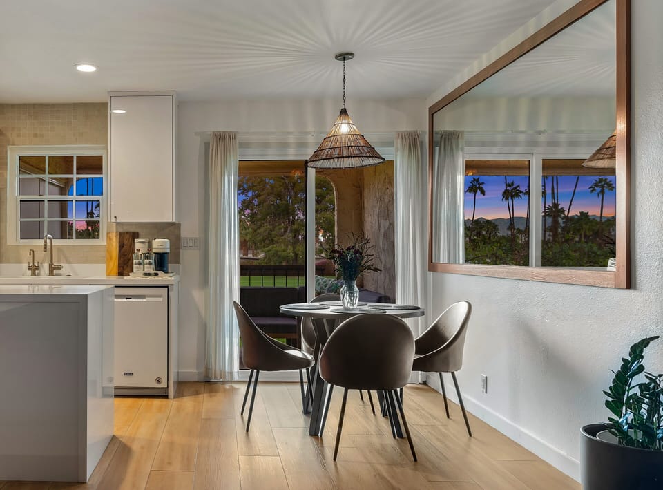 Dining with large mirror that amplifies views