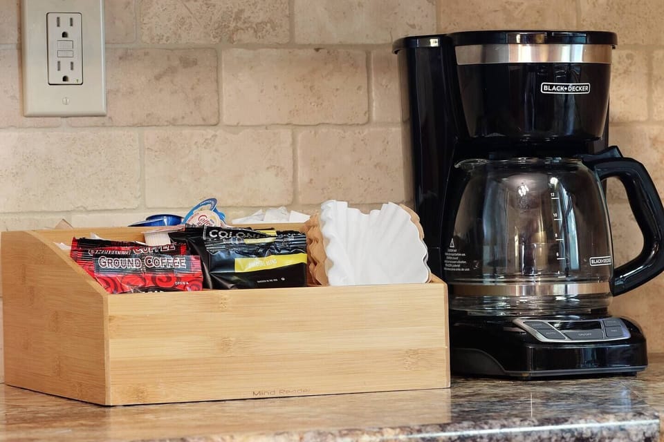 Our coffee bar is stocked with a few packages of ground coffee, filters, cream and sugar.  BUT...we still highly recommend you check out a local coffee shop while you are in town - Tempest and/or Copper Rock are our favorites!
