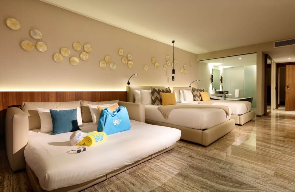 Junior suite with two queen beds and sofa bed