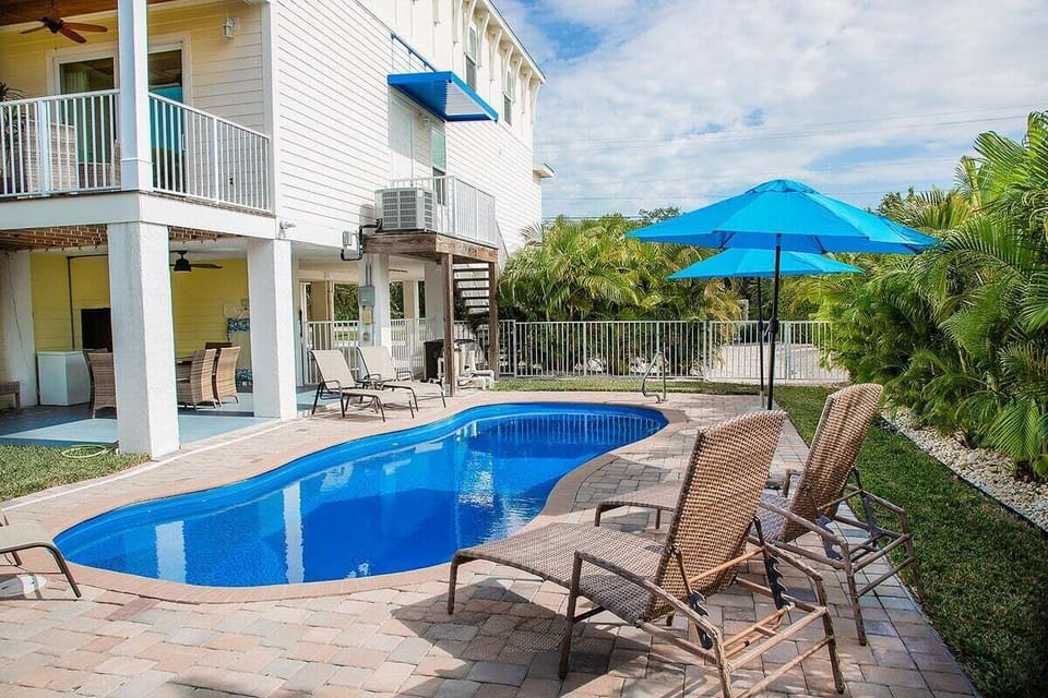 Dive into relaxation at our heated pool oasis. With cozy lounge chairs and shady spots, every moment here is a soothing escape.