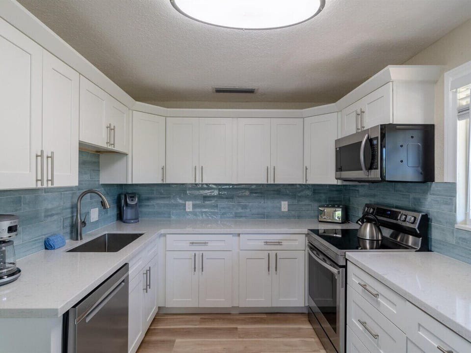 Modern appliances and ample workspace make cooking a pleasure.