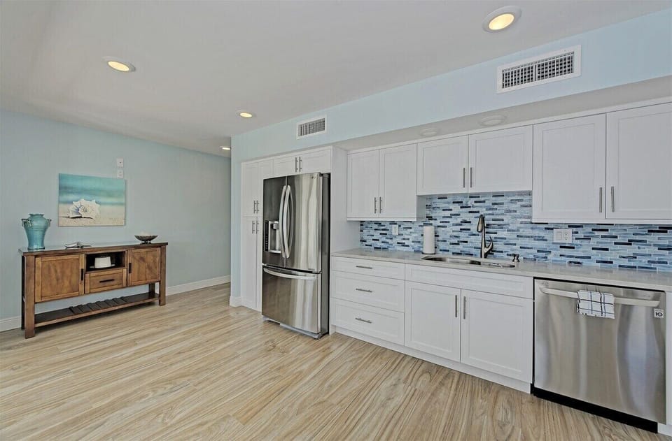 Fully equipped kitchen featuring modern appliances, abundant storage, and generous prep space.