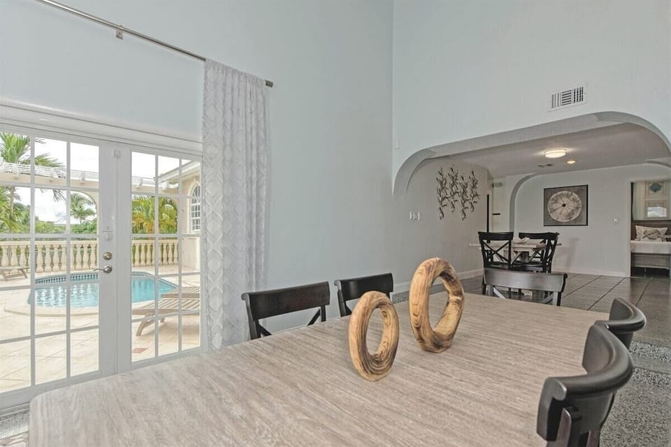 Entertainment meets elegance in this expansive area featuring a 6-seater dining space, a cozy living room, and an additional 4-seater table perfect for games or intimate dining.