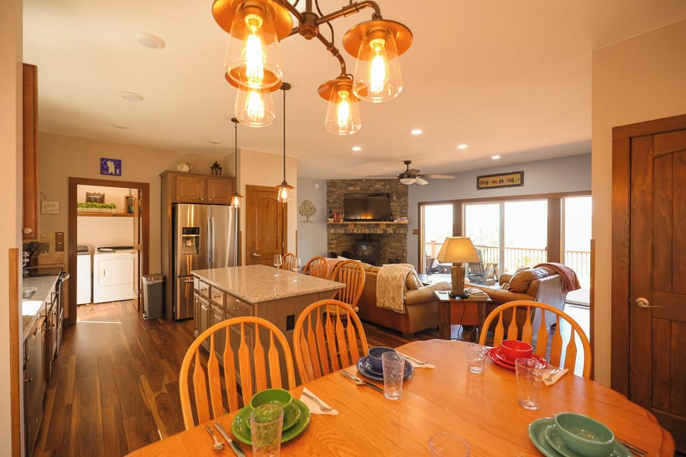 Inside the main living space. Washer and dryer shown on left.   